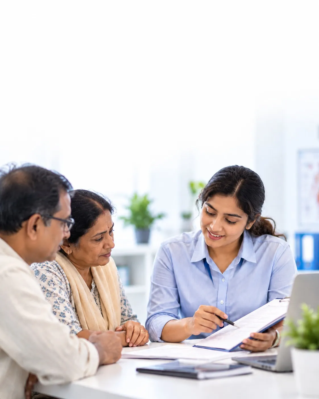 A care coordinator going through a prescription with an older couple